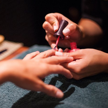 Guest getting Glen Ivy's Nourishing Manicure. This revitalizing luxury manicure leaves your hands and arms rejuvenated and your nails perfectly polished.