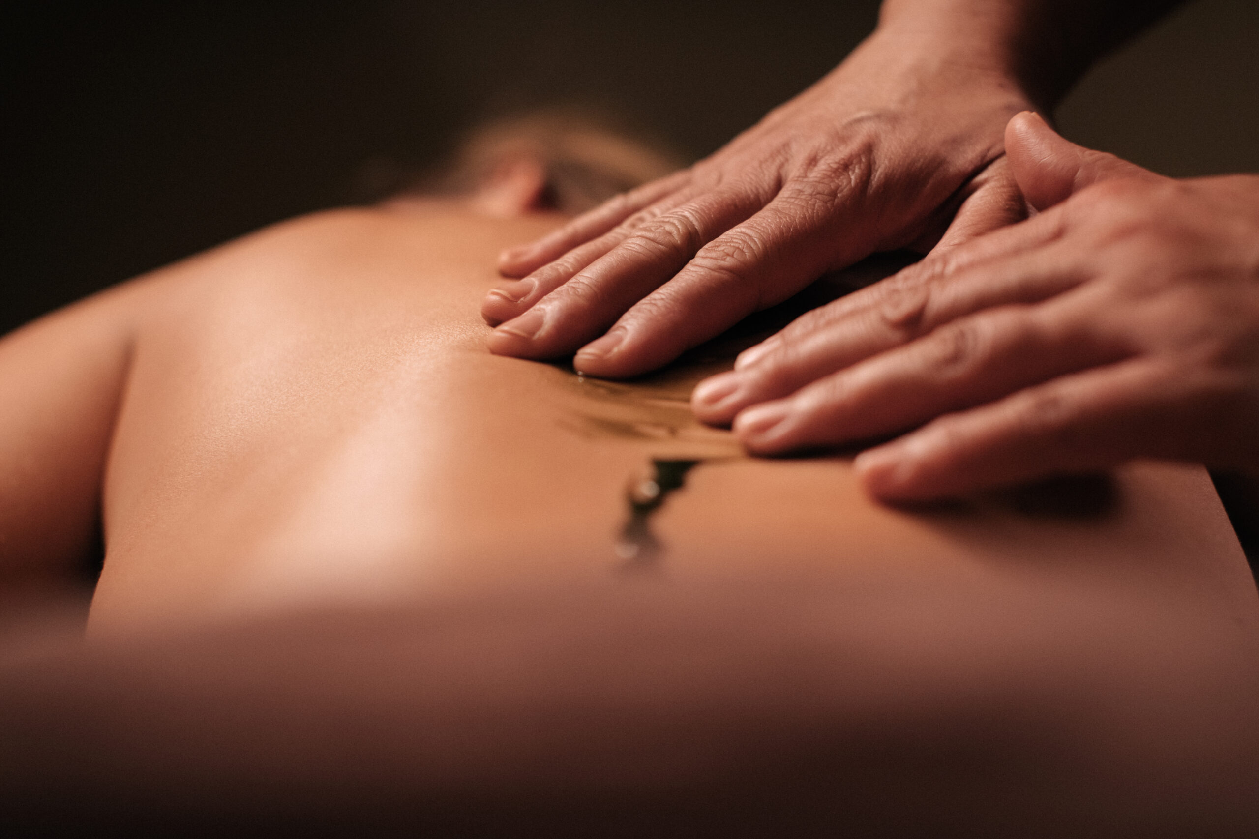 Woman receiving massage for muscle recovery and athletic performance at Glen Ivy Hot Springs.