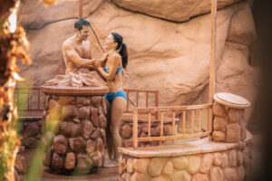 Couple enjoying Club Mud, Glen Ivy Hot Springs world-renowned red clay pit.